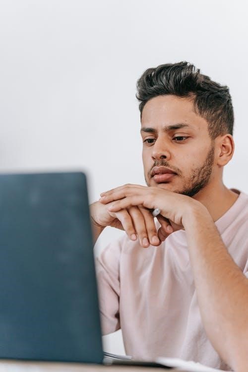 A person studying on a laptop